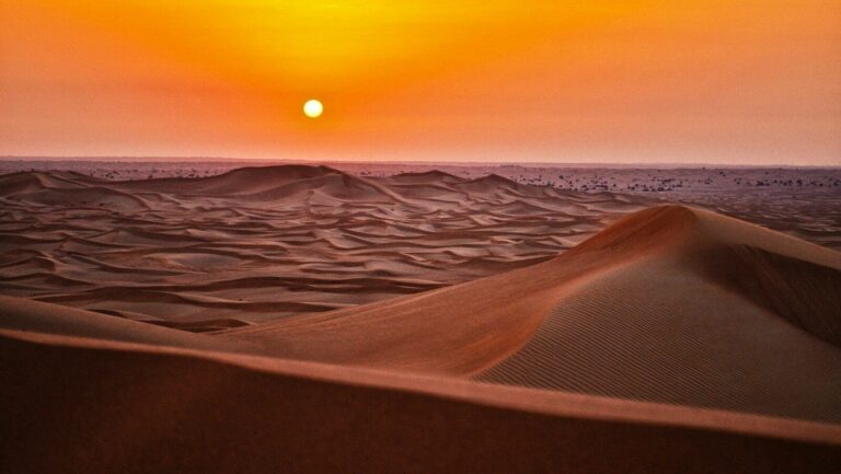 sand dunes during sunset
